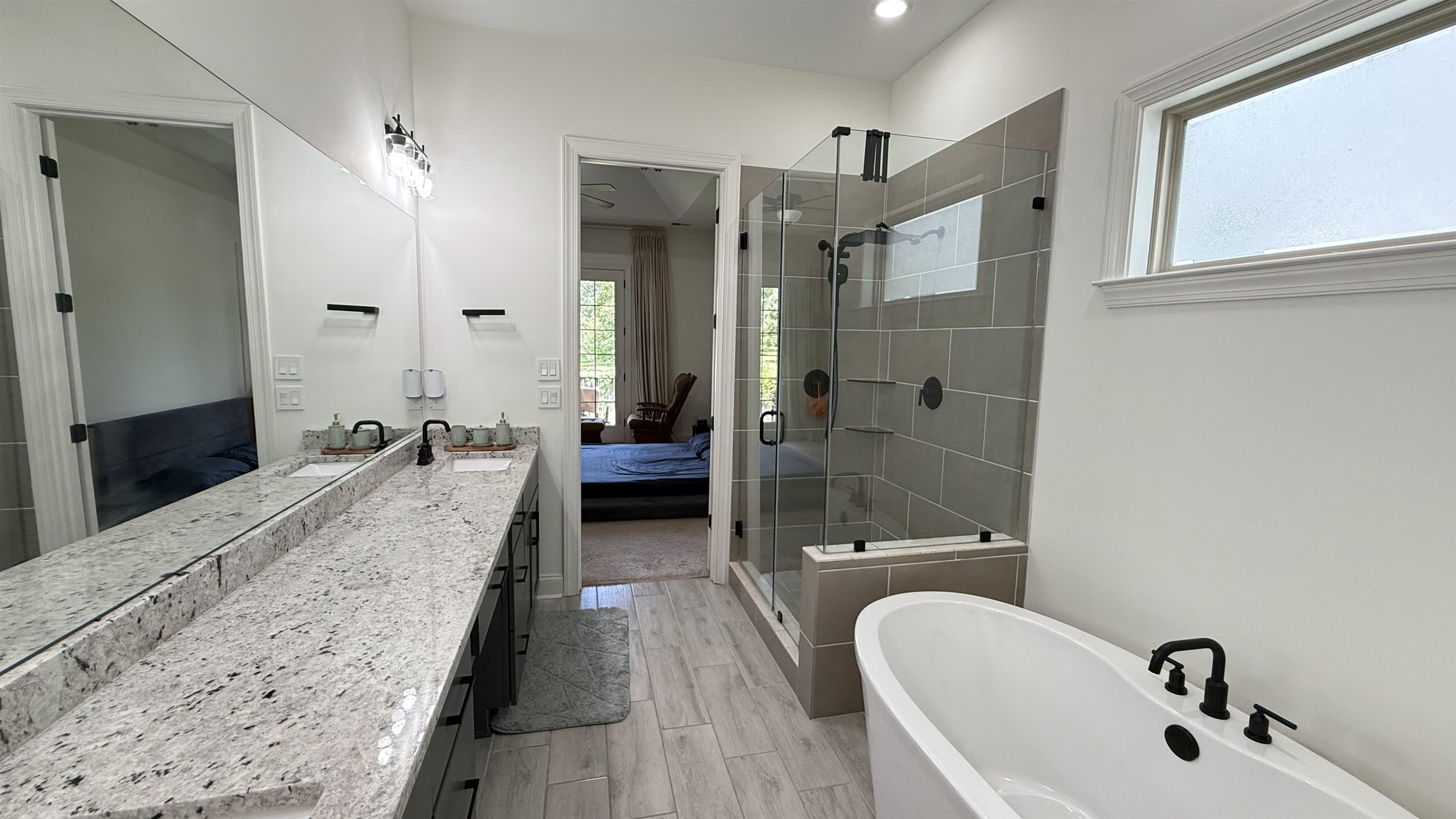 1746 Chadwick Farms Loop North Collierville, TN 38017 - Photo 14 of 35 Ensuite bathroom with a shower stall, a freestanding bath, vanity, wood finish floors, and recessed lighting