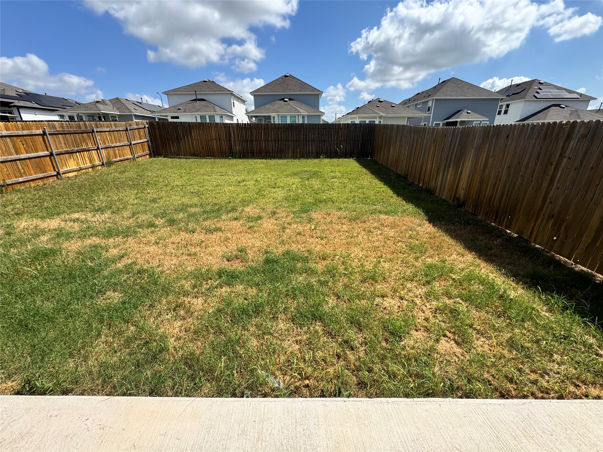 11820 Rush Lane Elgin, TX 78621 - Photo 31 of 31 Securely fenced yard offers a private outdoor retreat for leisure and recreation.