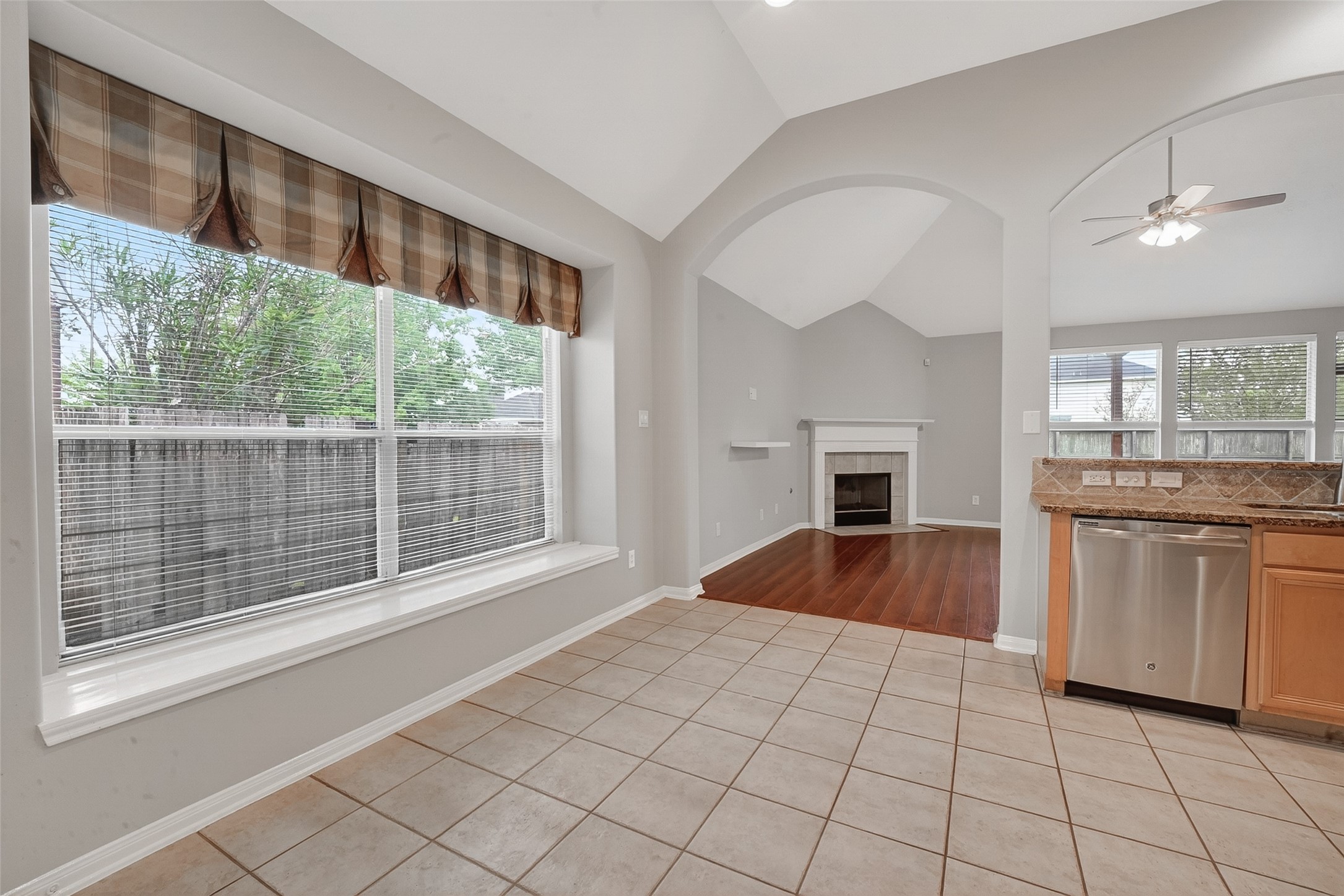 14308 Rocky Briar Lane Rosharon, TX 77583 - Photo 9 of 46 a view of an empty room with a kitchen and a window