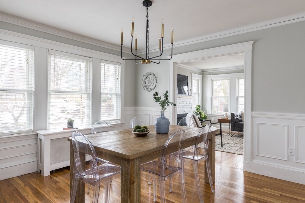 30 Fuller Road, Unit 30 Watertown, MA 02472 - Photo 4 of 24 a view of a dining room and livingroom with furniture wooden floor a chandelier