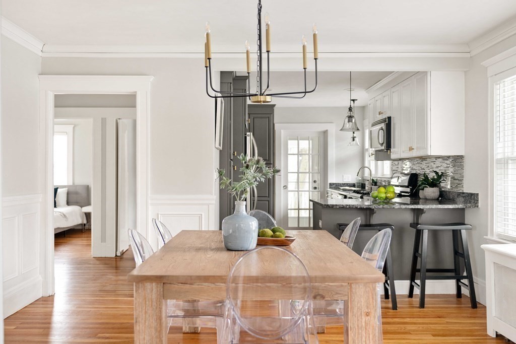 30 Fuller Road, Unit 30 Watertown, MA 02472 - Photo 6 of 24 a view of a dining room with furniture and wooden floor