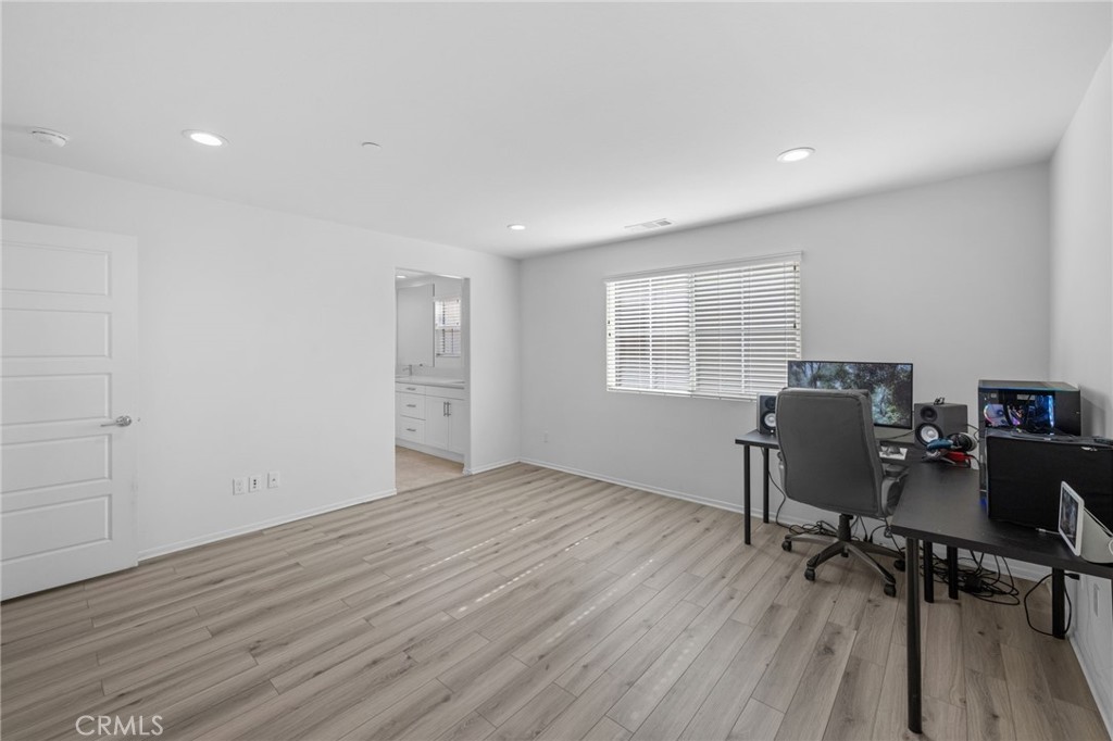 130 Citron Court Perris, CA 92571 - Photo 21 of 31 a view of workspace with wooden floor and windows