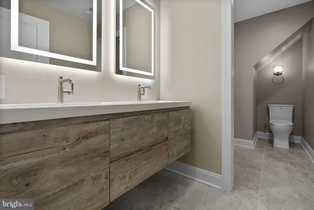 a utility room with sink dryer and washer