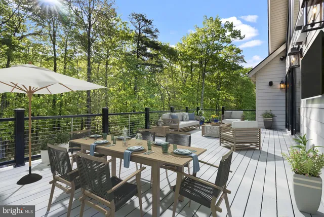 an outdoor space with seating area and trees