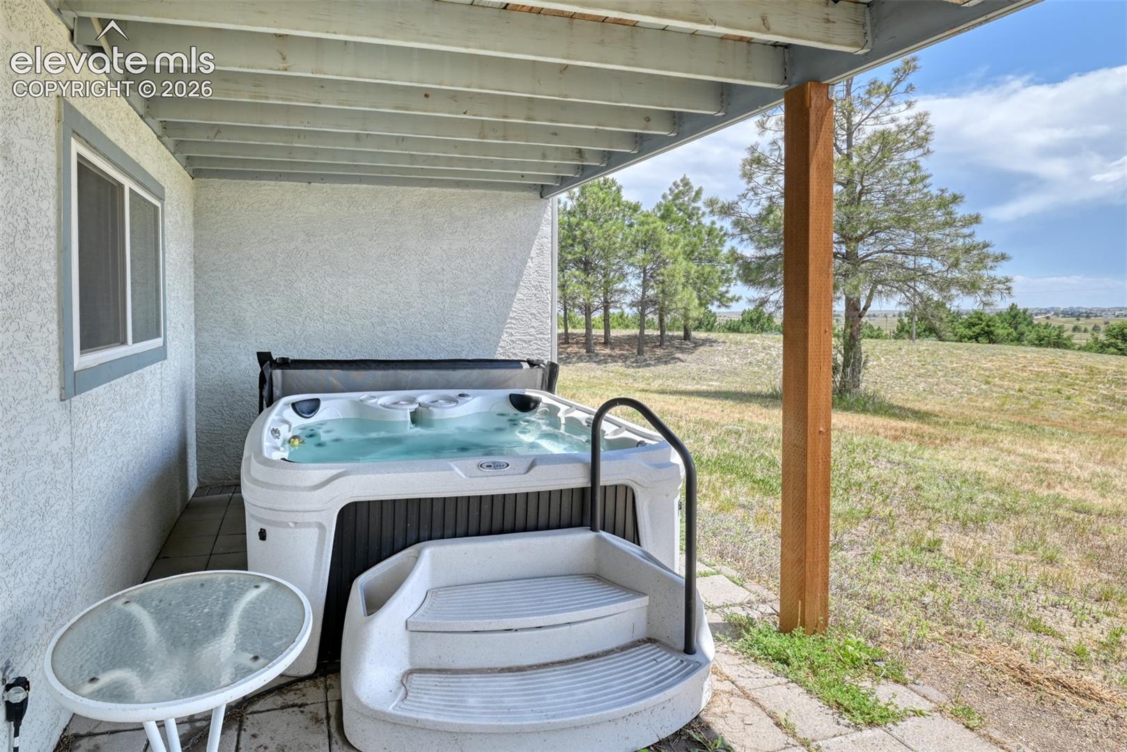 15680 Eastonville Road Elbert, CO 80106 - Photo 31 of 44 Hot tub located just outside the slider door in the walk out basement.
