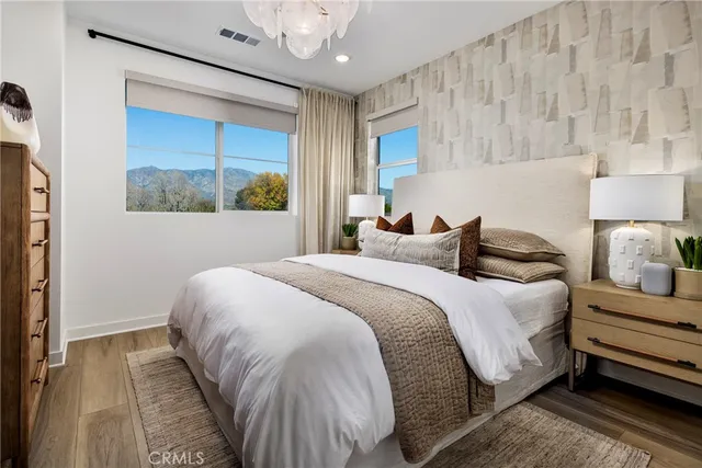 a bedroom with bed and a window