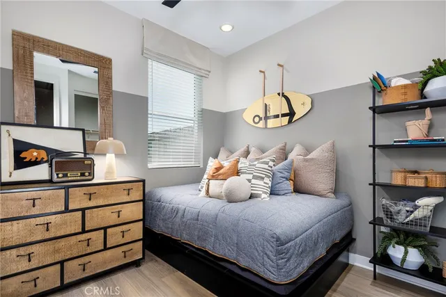 a bedroom with a bed and window