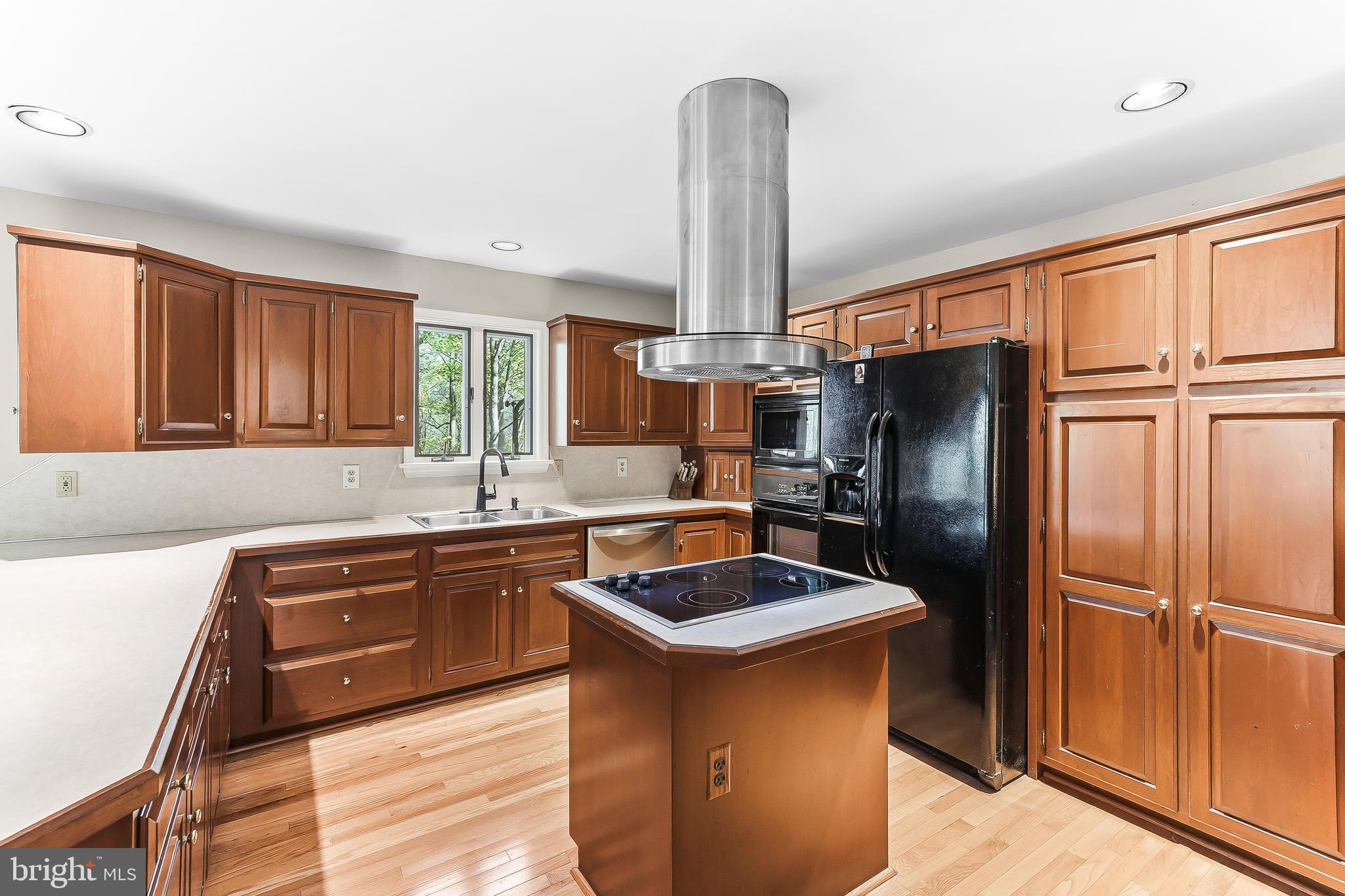 522 Ridge Drive Lincoln University, PA 19352 - Photo 15 of 63 a kitchen with stainless steel appliances granite countertop a refrigerator a sink dishwasher and wooden cabinets with a granite countertops