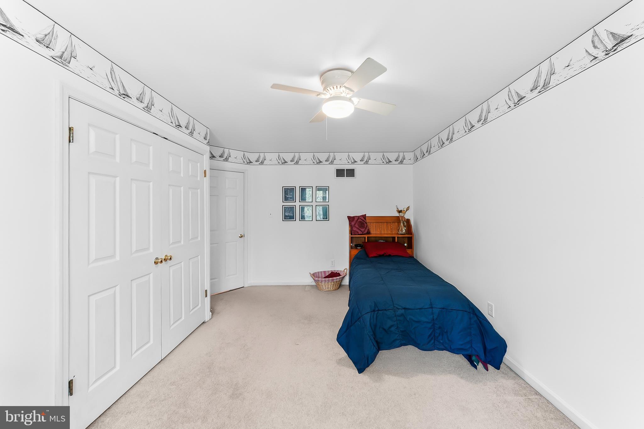 522 Ridge Drive Lincoln University, PA 19352 - Photo 33 of 63 a view of a hallway with stairs and a chandelier fan