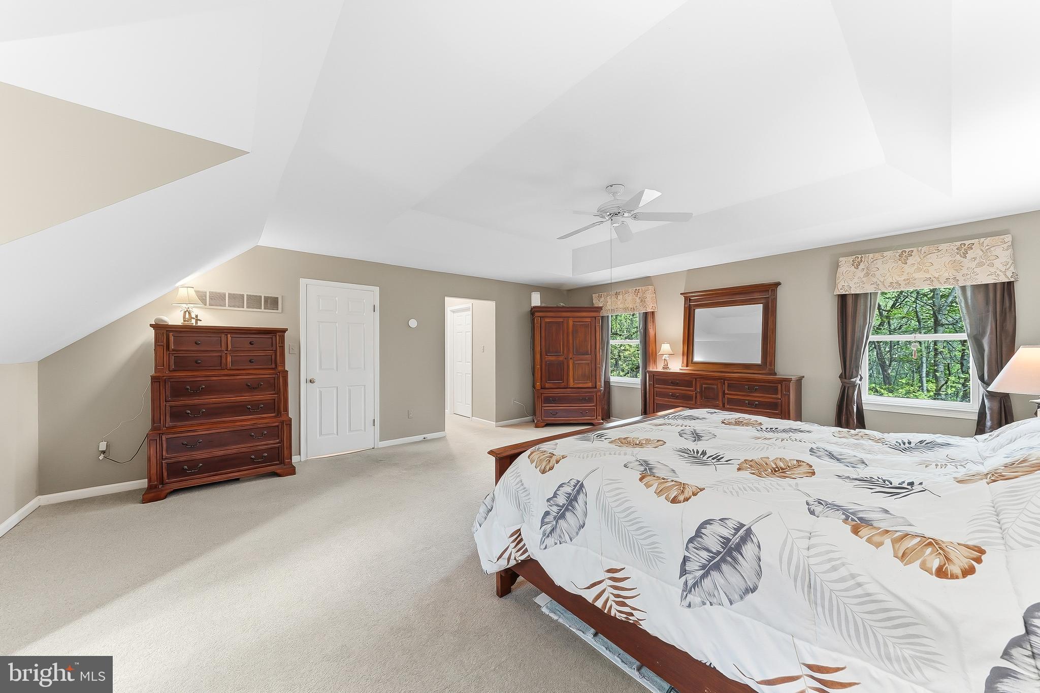 522 Ridge Drive Lincoln University, PA 19352 - Photo 36 of 63 a spacious bedroom with a bed a dresser and a window