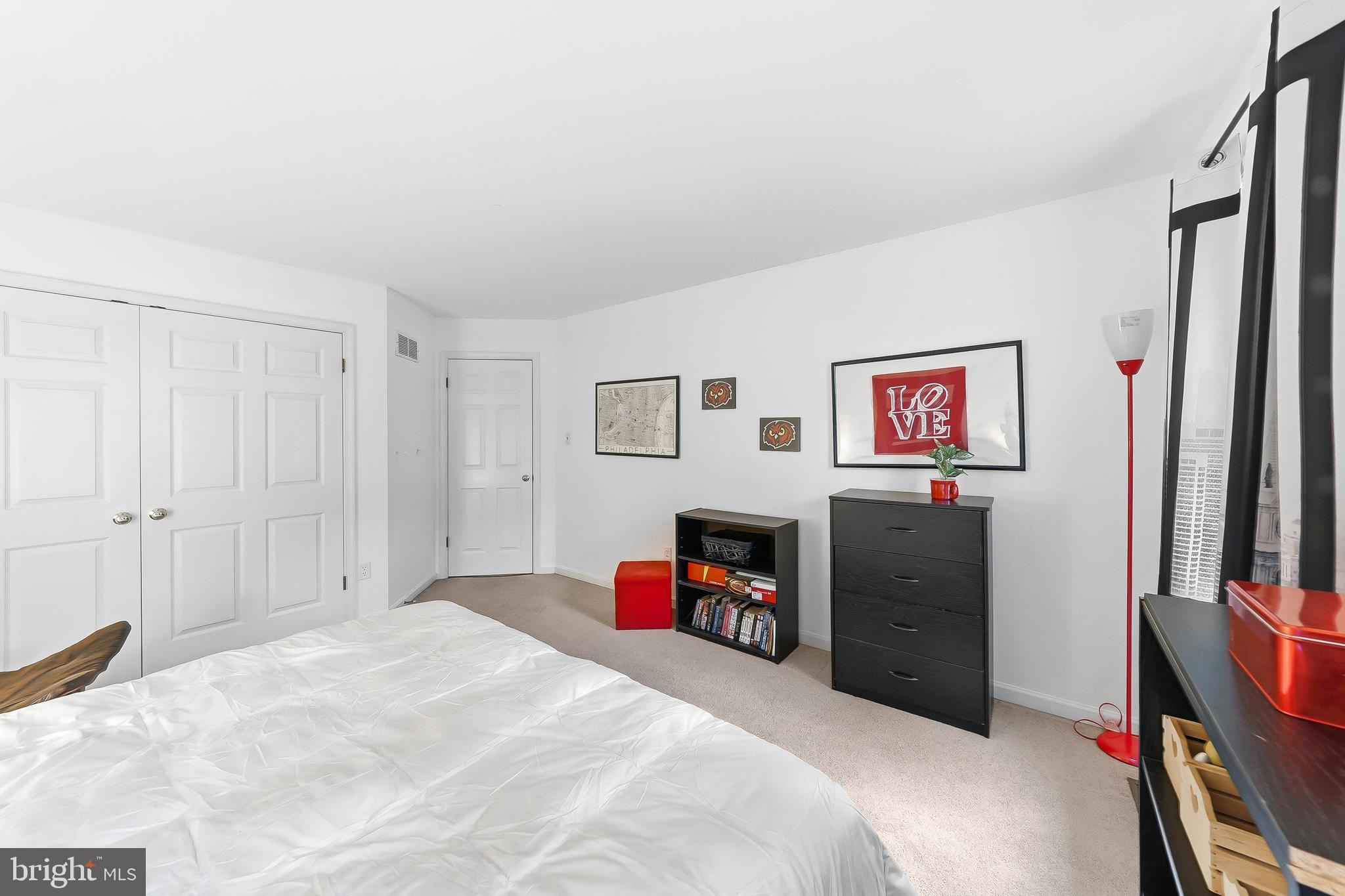 522 Ridge Drive Lincoln University, PA 19352 - Photo 39 of 63 a bedroom with a bed and a flat screen tv