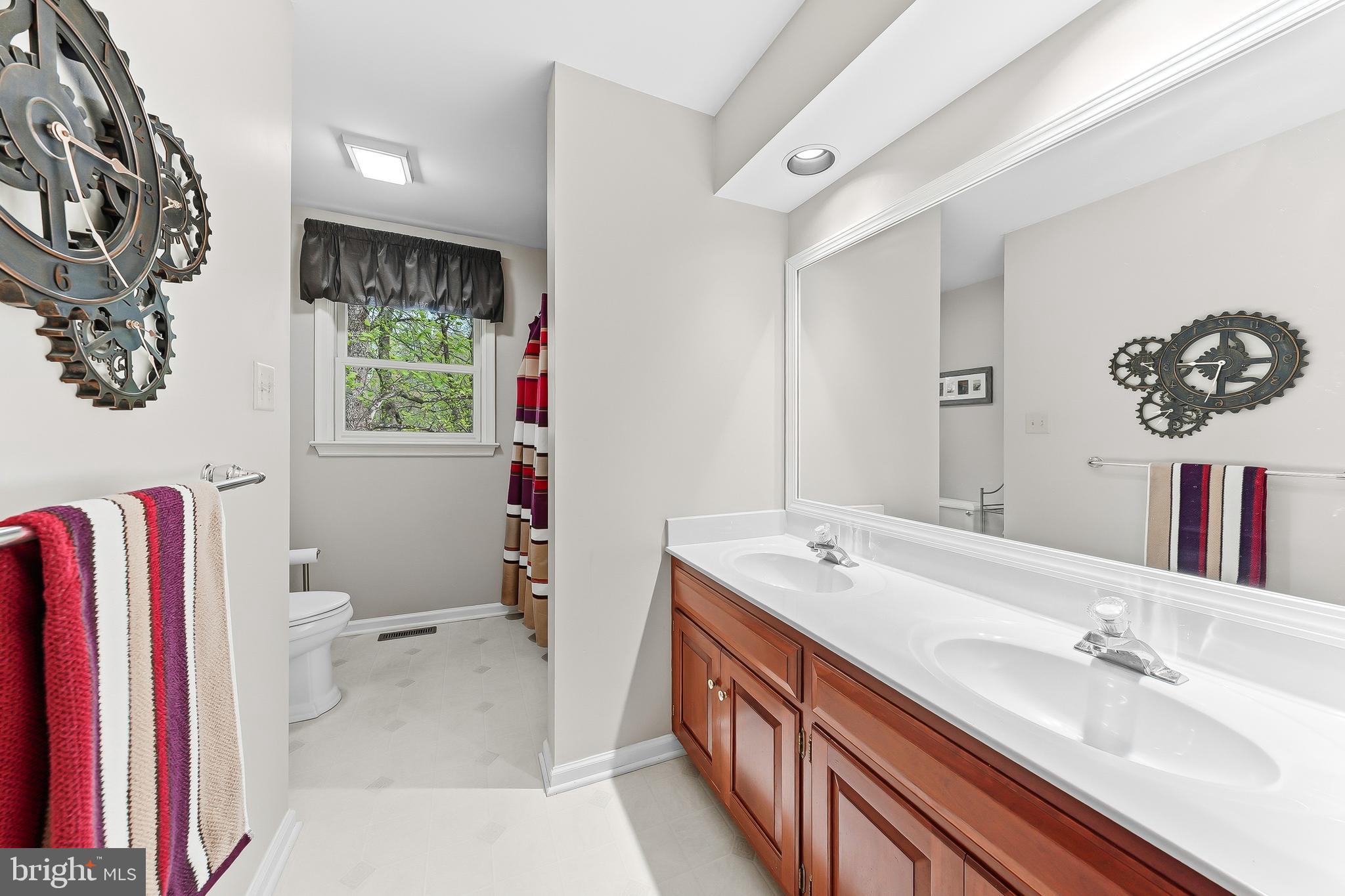 522 Ridge Drive Lincoln University, PA 19352 - Photo 40 of 63 a bathroom with a sink a toilet and a mirror