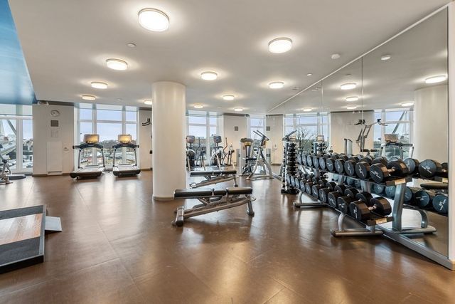 a view of a room with lots of gym equipment