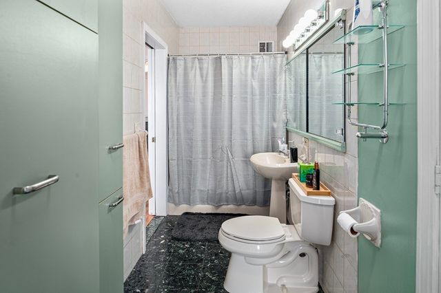 a bathroom with a sink and toilet
