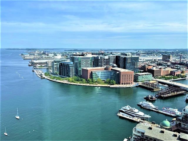 an aerial view of a house with a ocean view