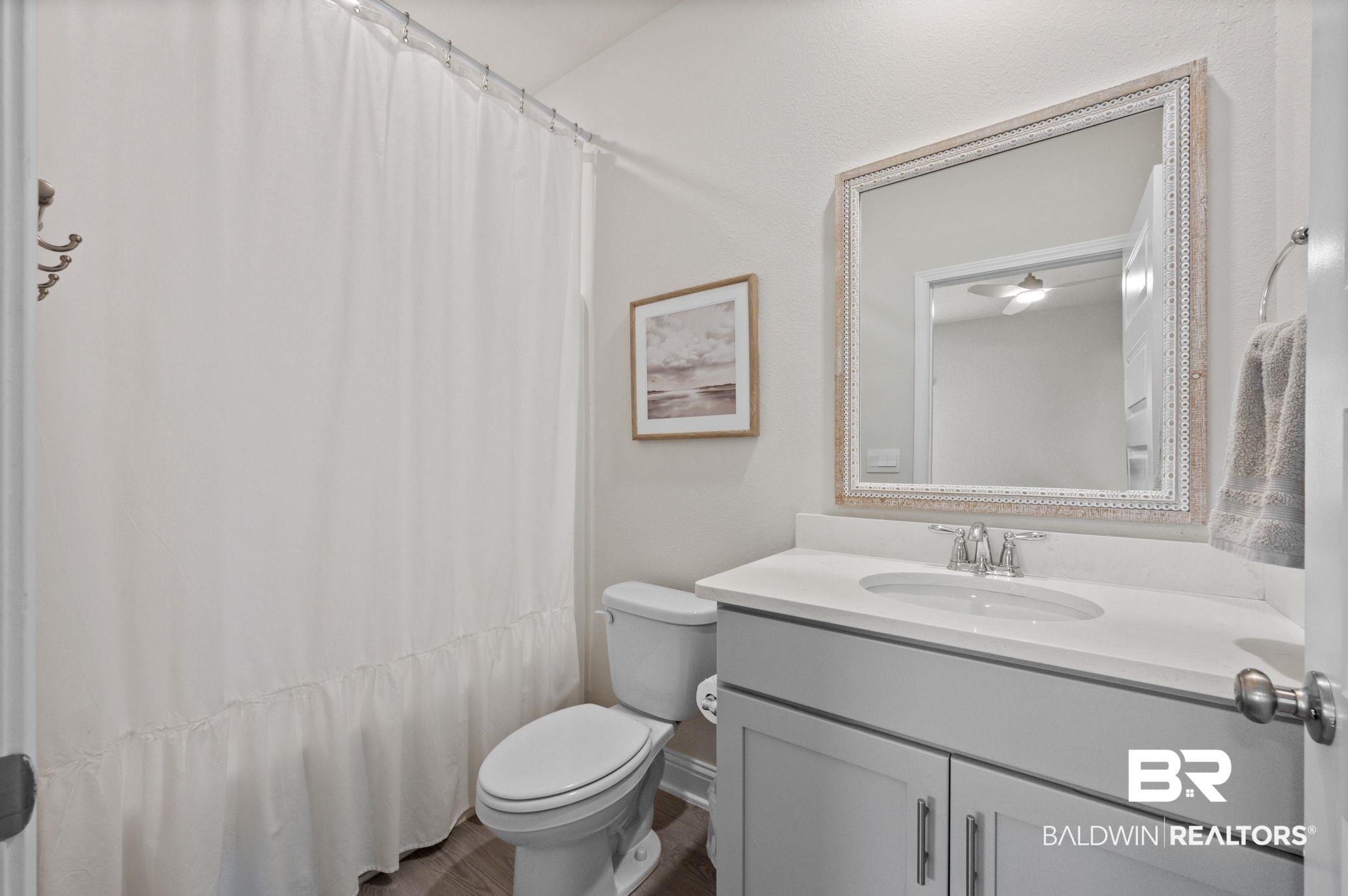681 Calibre Street Fairhope, AL 36532 - Photo 45 of 56 Bathroom featuring vanity, toilet, and a shower with shower curtain