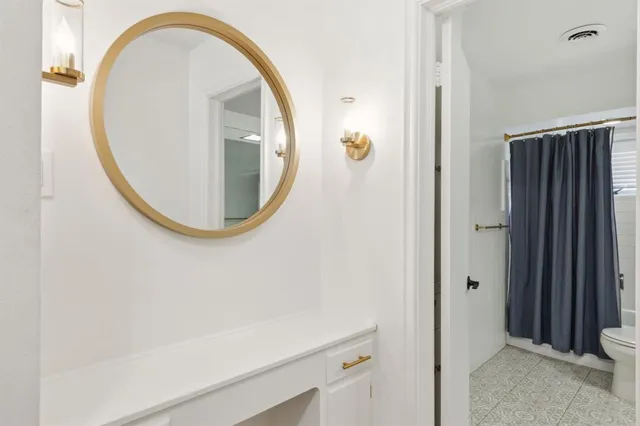 an entryway view with wooden floor and glass door
