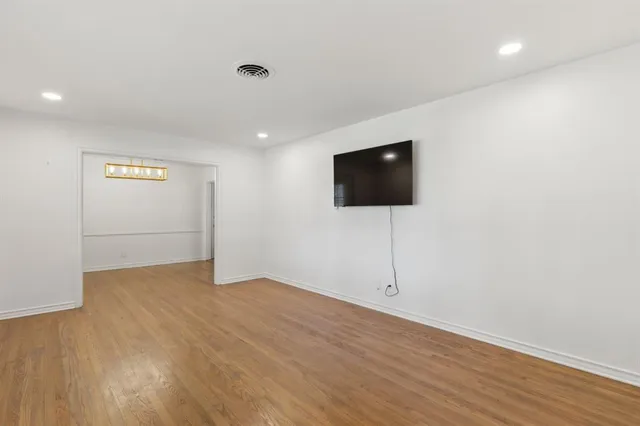 a view of a livingroom with wooden floor