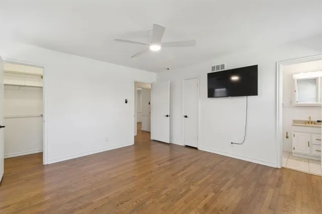 a view of a livingroom with an empty space and a window