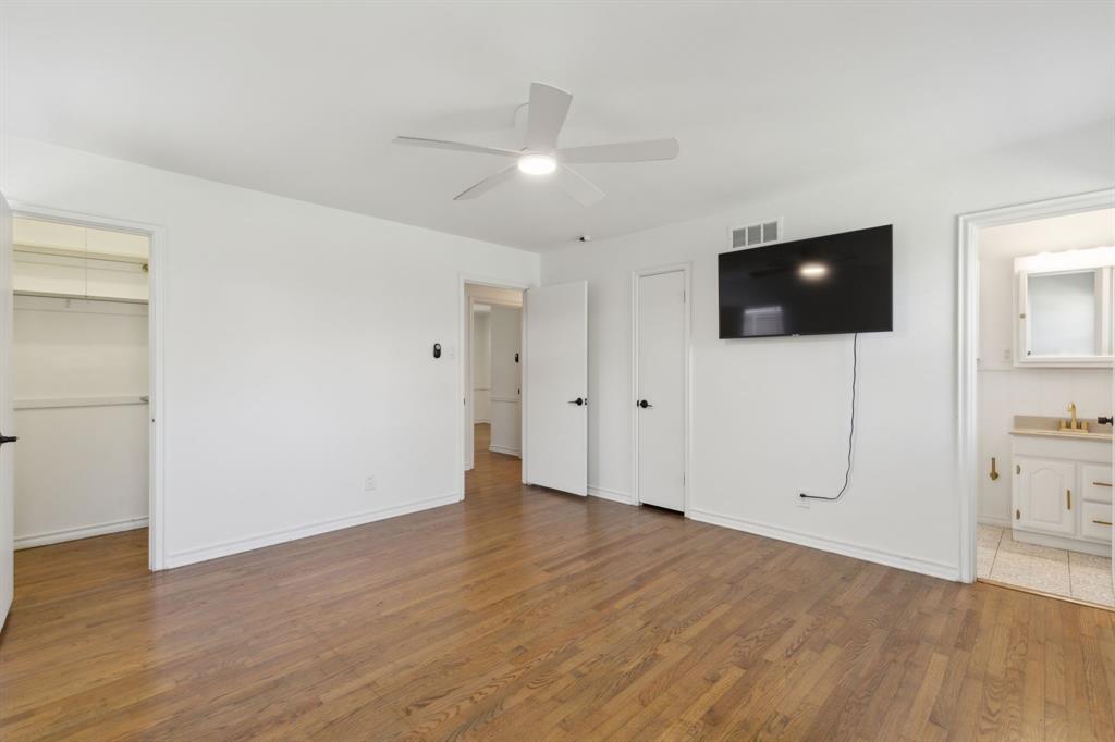 10510 Gooding Drive Dallas, TX 75229 - Photo 10 of 14 a view of a livingroom with an empty space and a window