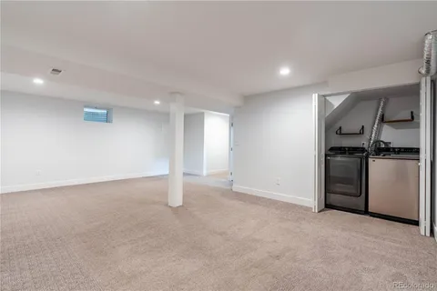 a bathroom with a sink mirror vanity and toilet