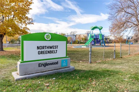 a view of a yard with a large tree
