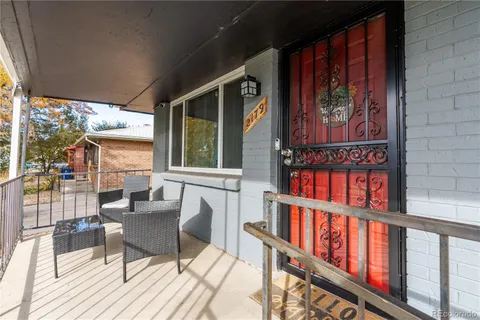 a living room with furniture flowerpot and a potted plant