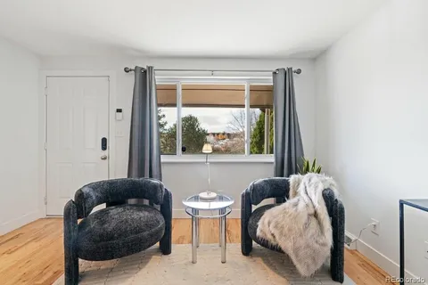 a kitchen with white cabinets stainless steel appliances and sink