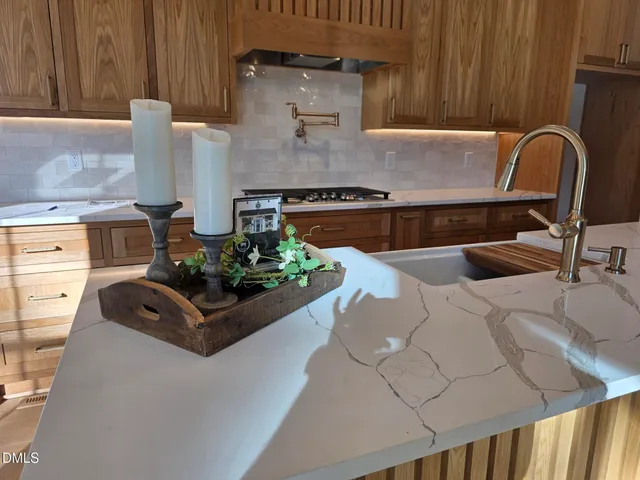 wooden floor with white walls and door