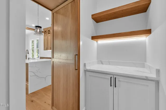 an empty room with fan and windows