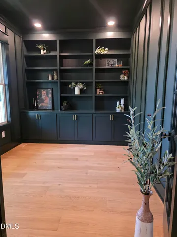 a view of living room with furniture and fireplace