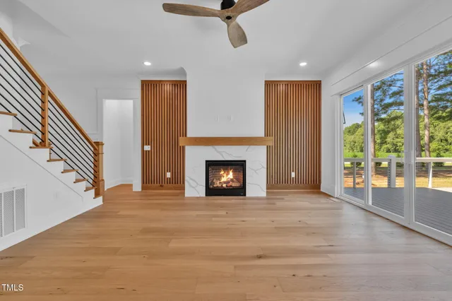 a kitchen with a stove and a wooden floor
