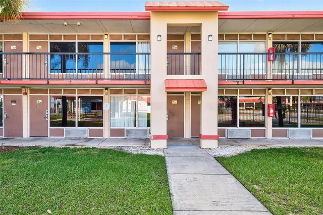 a front view of building with yard