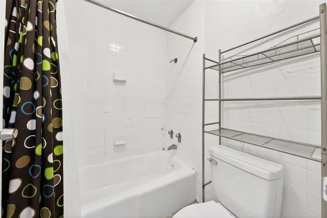 an aerial view of a house with swimming pool and ocean view