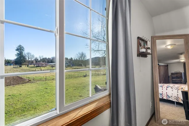 a view of a room that has a bed