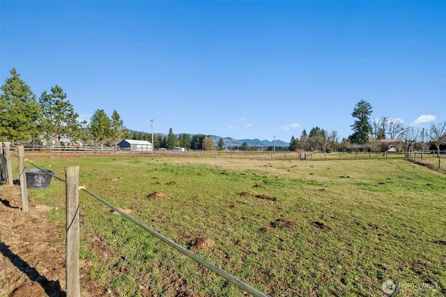 a view of a field with an outdoor space