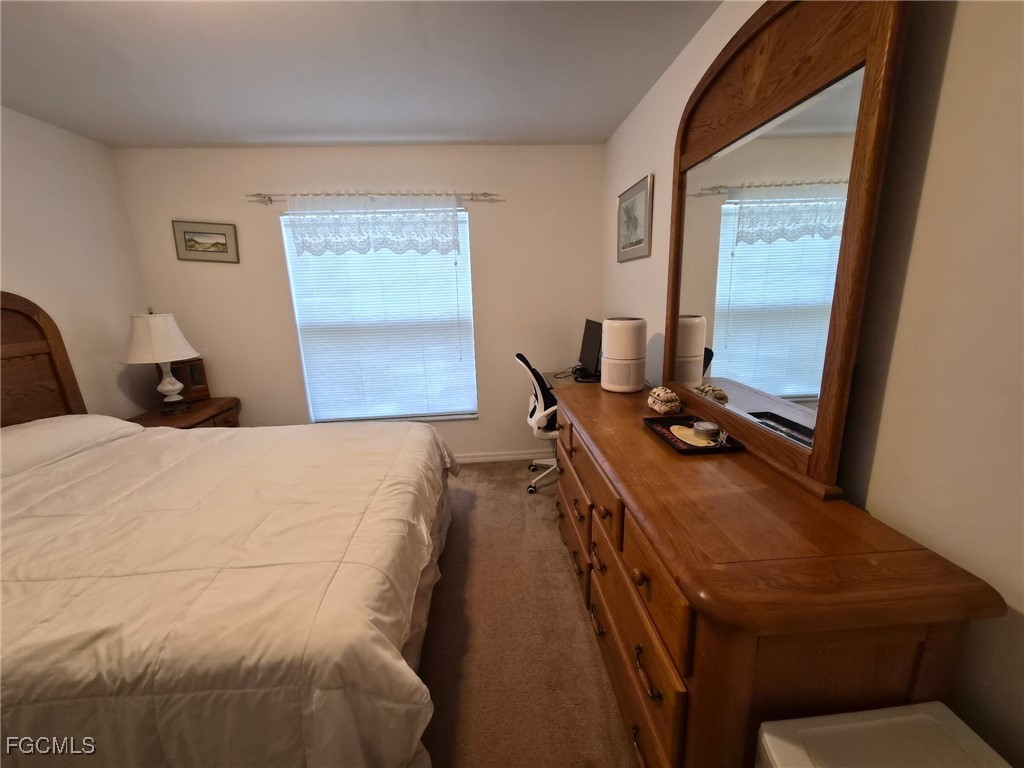 2604 Old Burnt Store Road North Cape Coral, FL 33993 - Photo 2 of 13 a bed room with a bed and a window