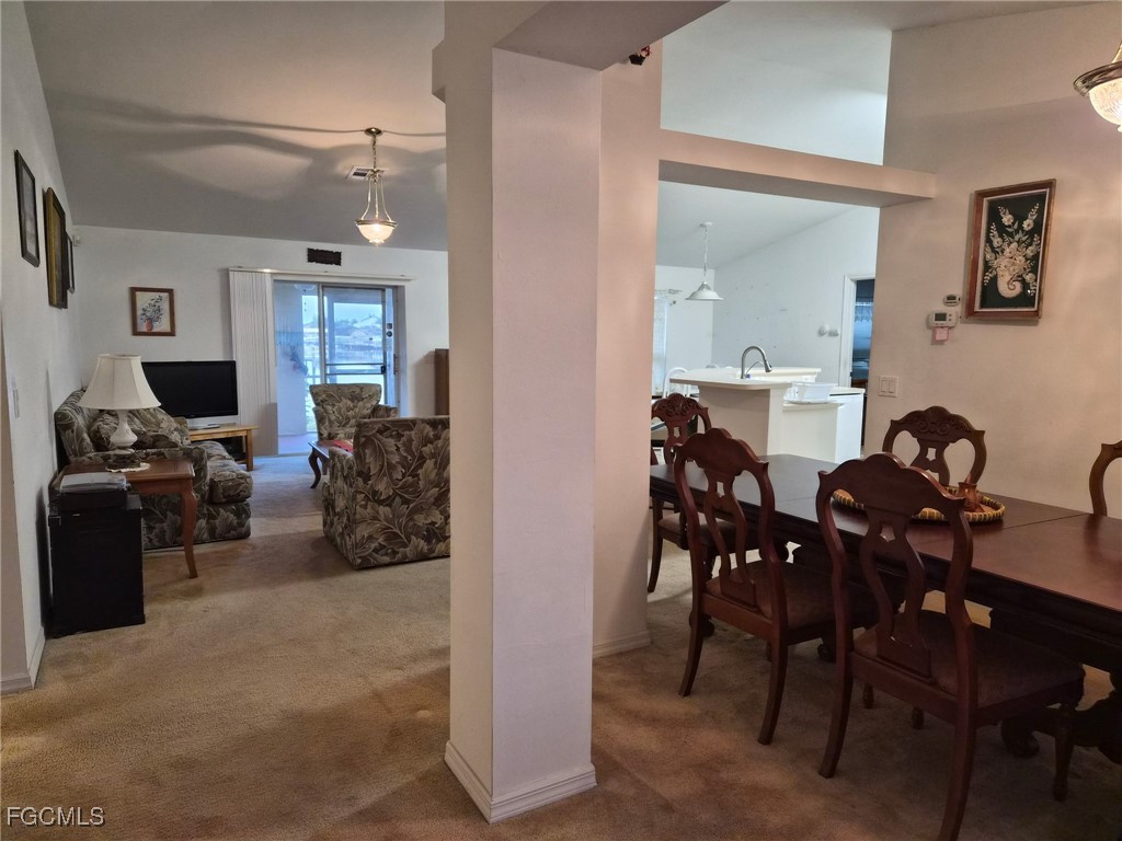 2604 Old Burnt Store Road North Cape Coral, FL 33993 - Photo 8 of 13 a view of a livingroom with furniture and a flat screen tv