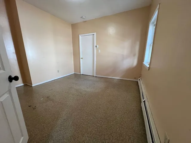 a bathroom with a shower and a sink