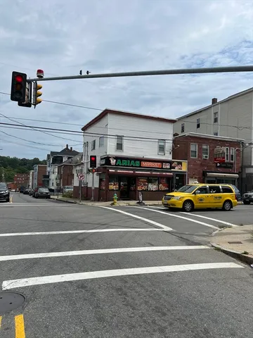 a view of a cars parked in front of a house