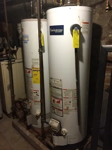a open kitchen with granite countertop white cabinets and wooden floor