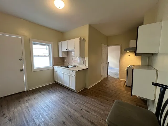 a kitchen with a stove and a microwave