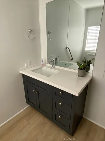 a bathroom with a sink and a mirror