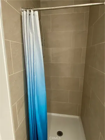 a bathroom with a shower and a tub