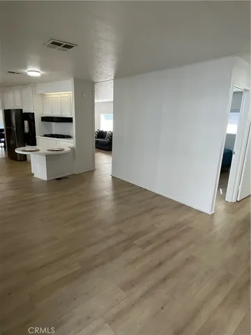 a view of a kitchen with a sink and a stove top oven