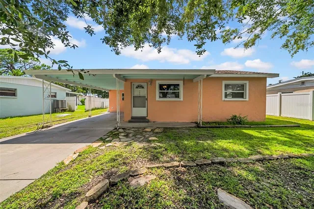 a view of a house with a yard
