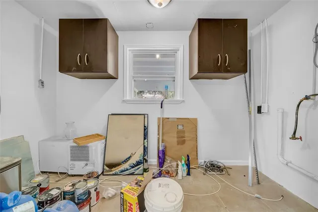 a view of a big room with wooden floor and windows in a room