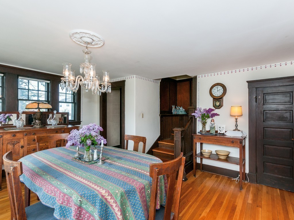 17 Clinton Street Hopkinton, MA 01748 - Photo 13 of 27 a view of a dining room with furniture and chandelier