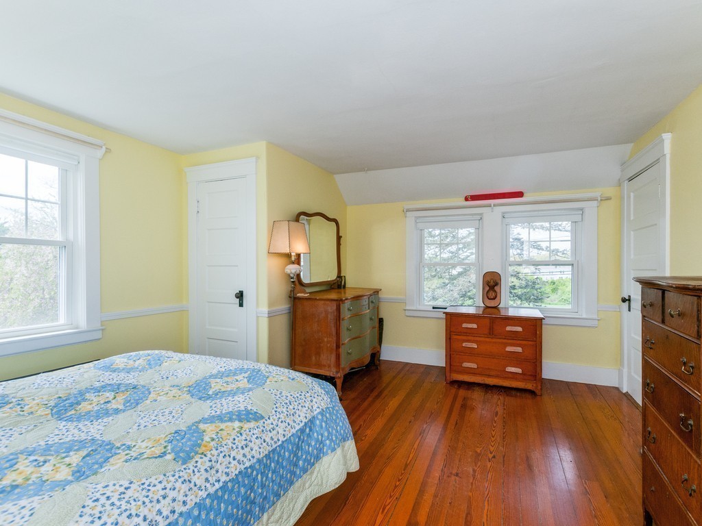 17 Clinton Street Hopkinton, MA 01748 - Photo 14 of 27 a bedroom with a bed and wooden floor