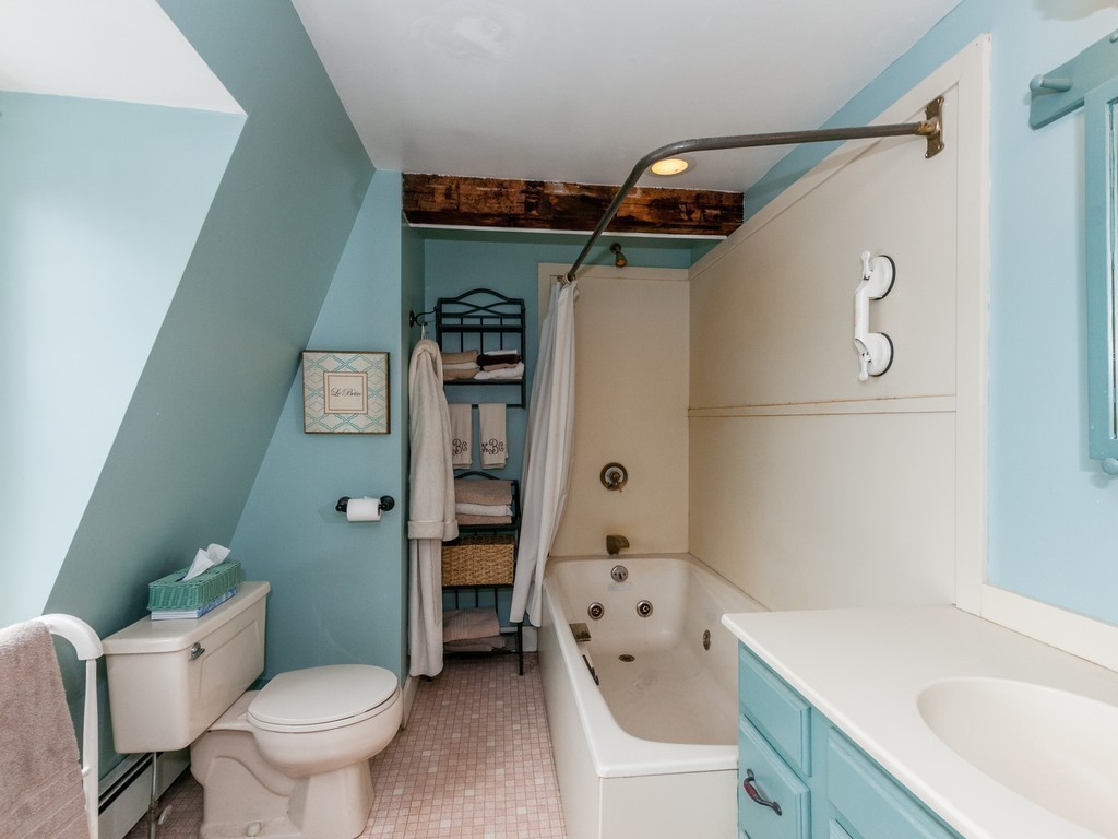 17 Clinton Street Hopkinton, MA 01748 - Photo 18 of 27 a bathroom with a sink toilet and shower